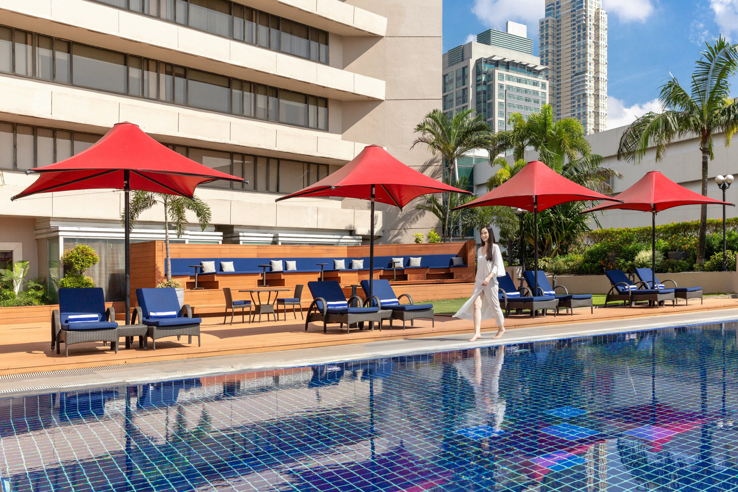 dusit-thani-manila-pool-lifestyle-walking